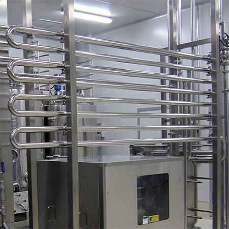 Holding Tubes - Non-sloped stainless steel holding tubes in HTST pasteurization system.