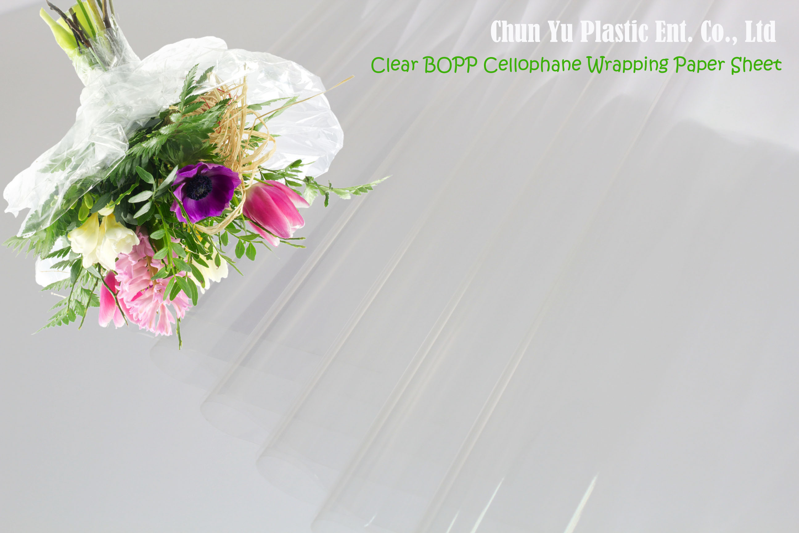 Cut flower bouquet wrapped with clear cellophane wrapping paper sheet