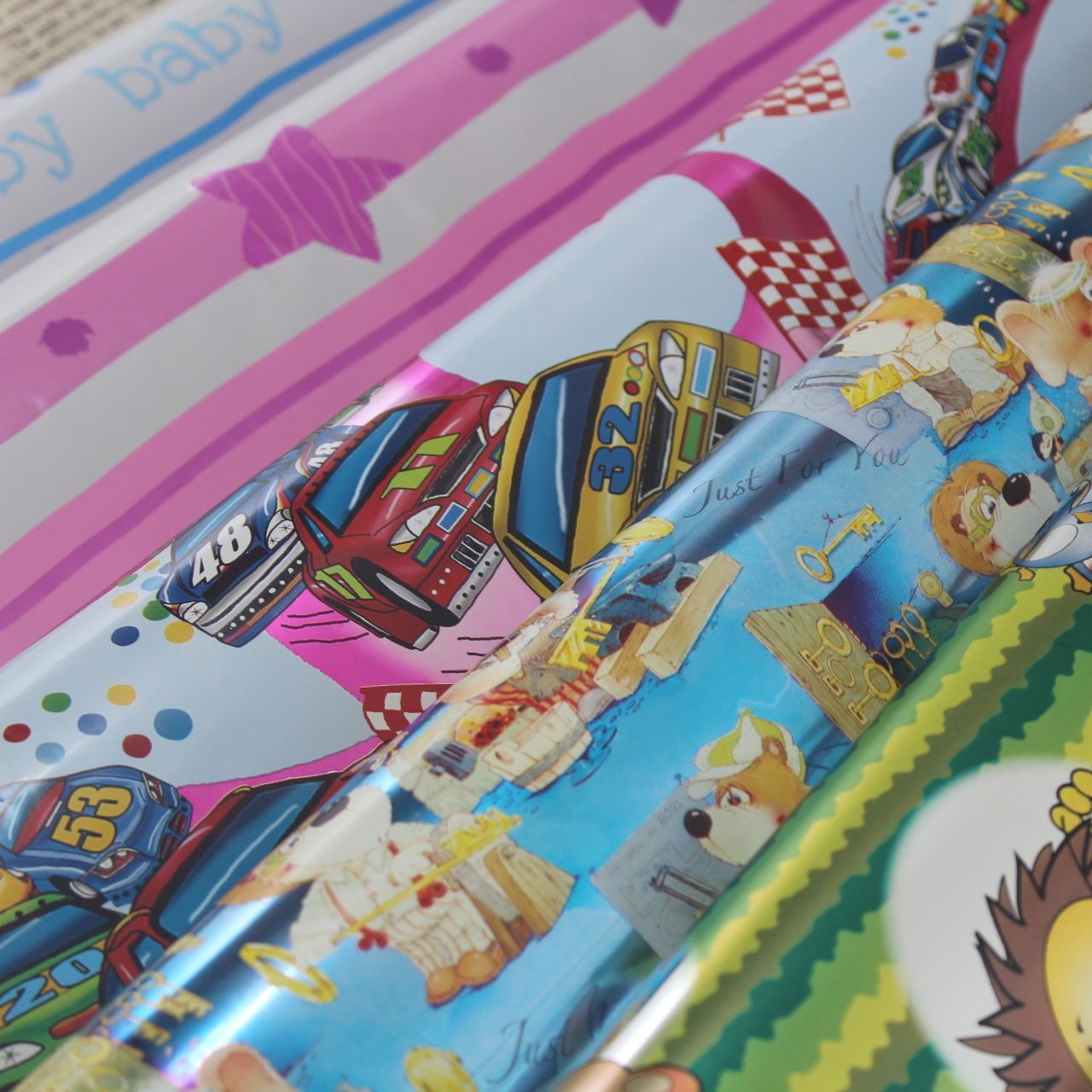 Metallic BOPP gift wrapping paper printed with children designs for birthday parties.