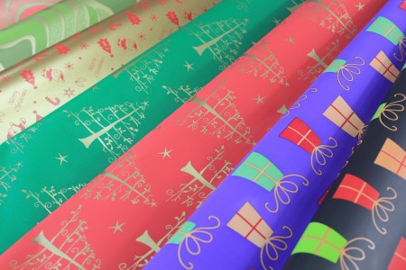 Metallic gift wrapping paper with Christmas design printed