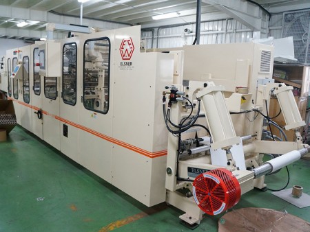 Fully automatic converting machine to make small roll of gift wrapping paper.